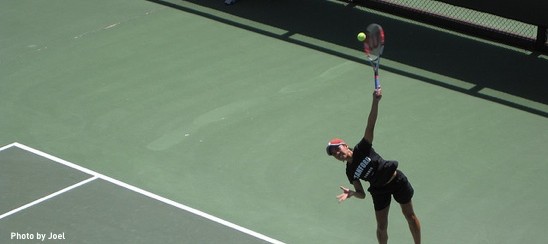 Tennis athlete serving