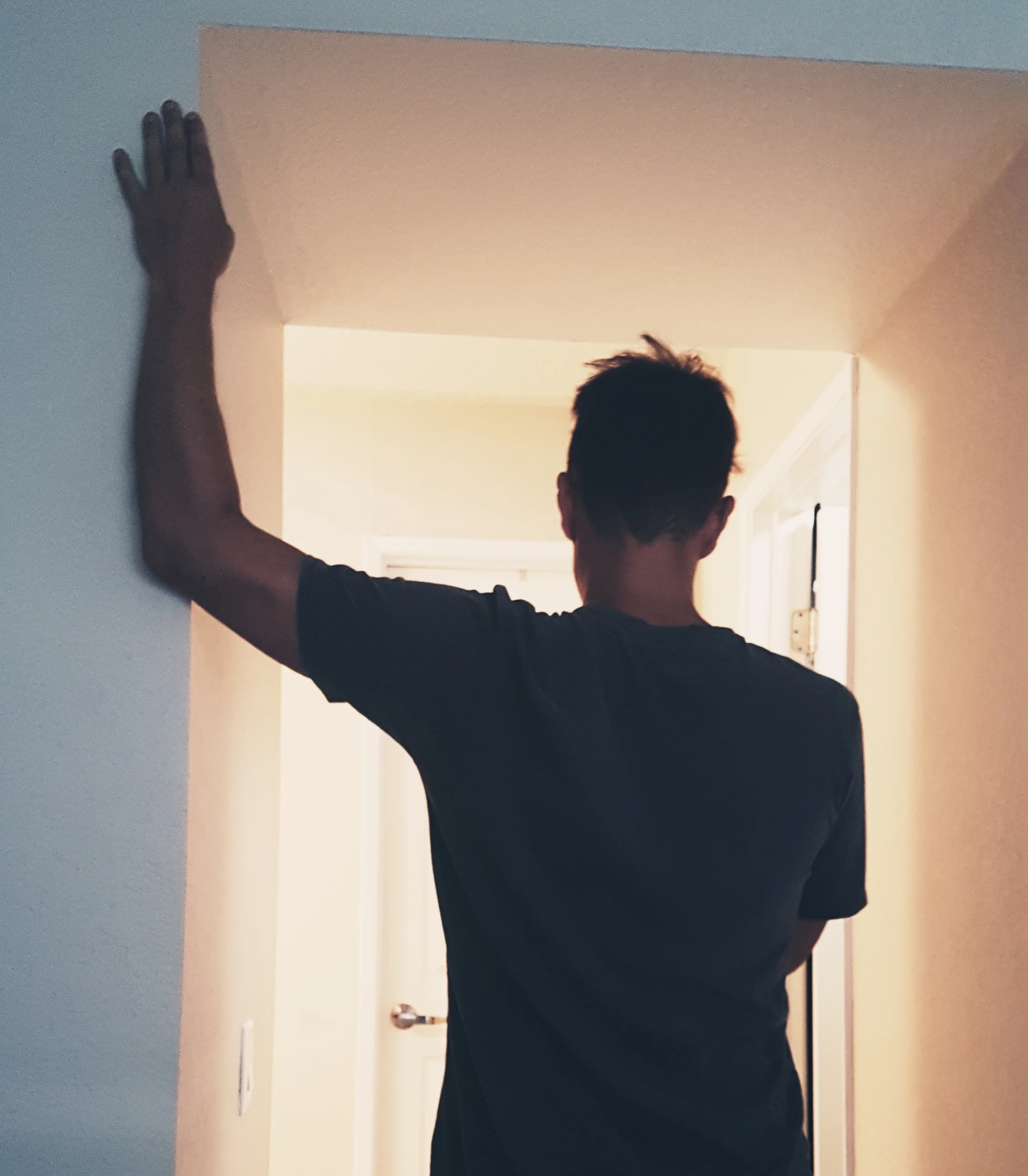 grant of your wellness nerd doing a pec stretch with a door frame