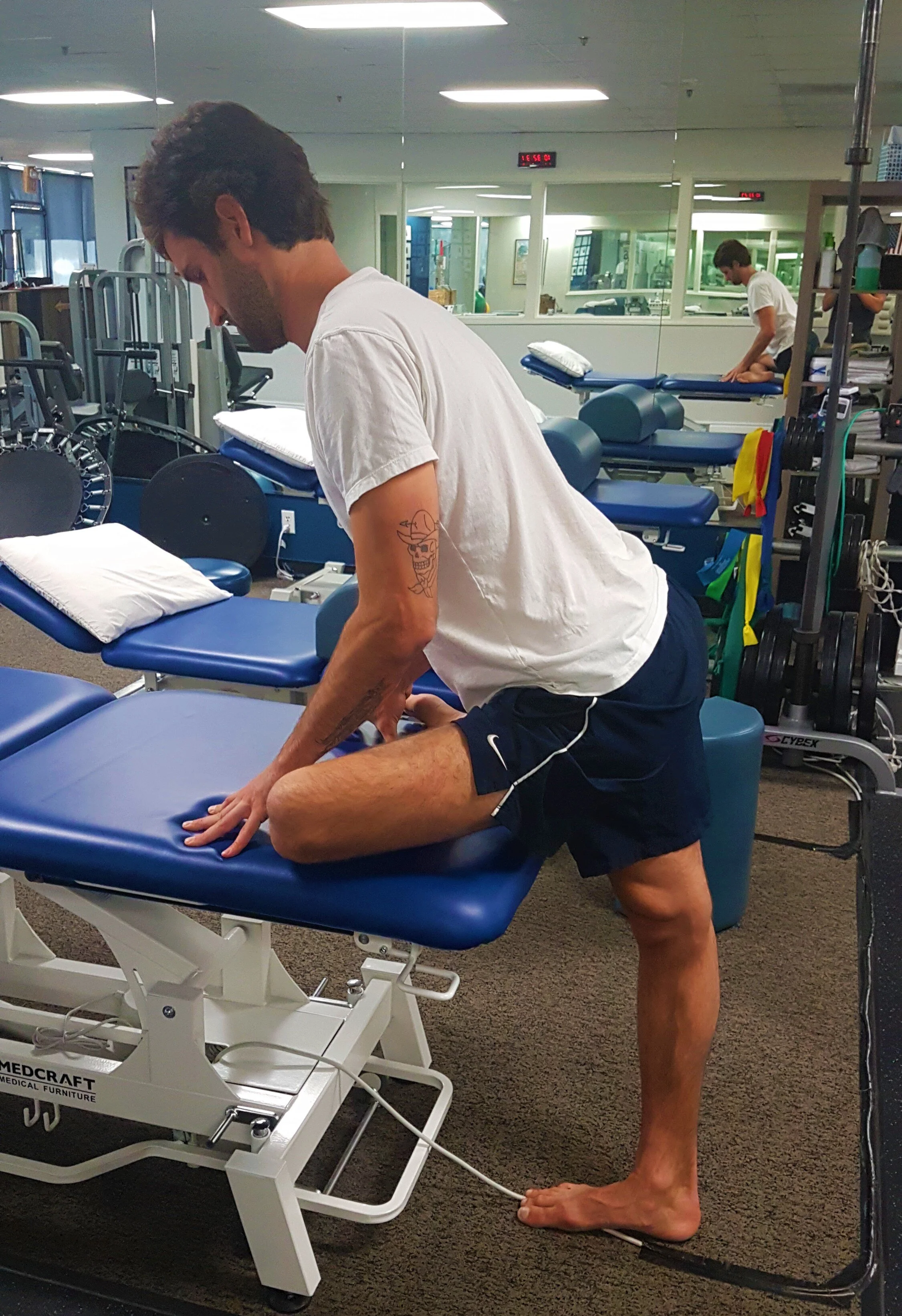 standing hip external rotation stretch on chair - pigeon stretch