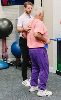 A patient doing a guided exercise with a physical therapist