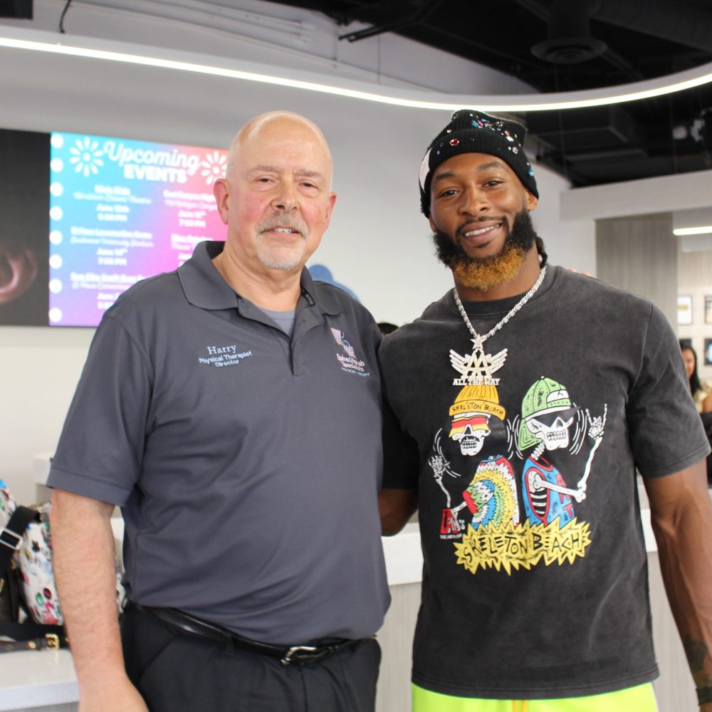 Two men posing together at an event